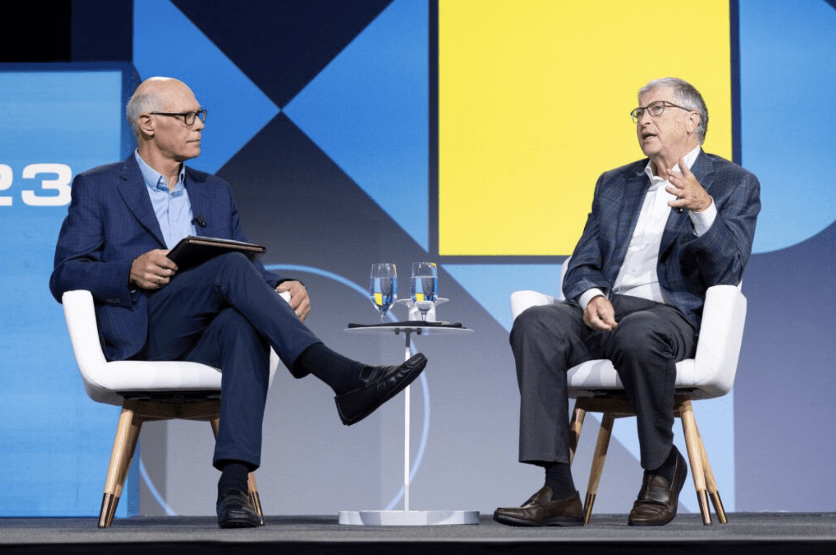 BE Founder Bill Gates on stage with EEI Chair Warner Baxter