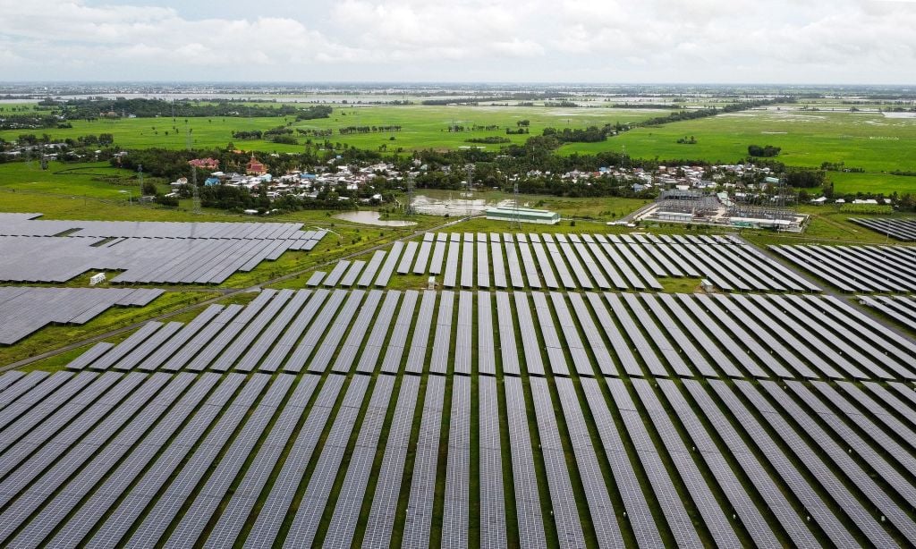 Aerial view of the Sao Mai solar plant in An Giang province in Vietnam in 2022. Solar power has grown quickly in Vietnam, but the country is still heavily reliant on fossil fuels. Photo by STR/AFP via Getty Images.